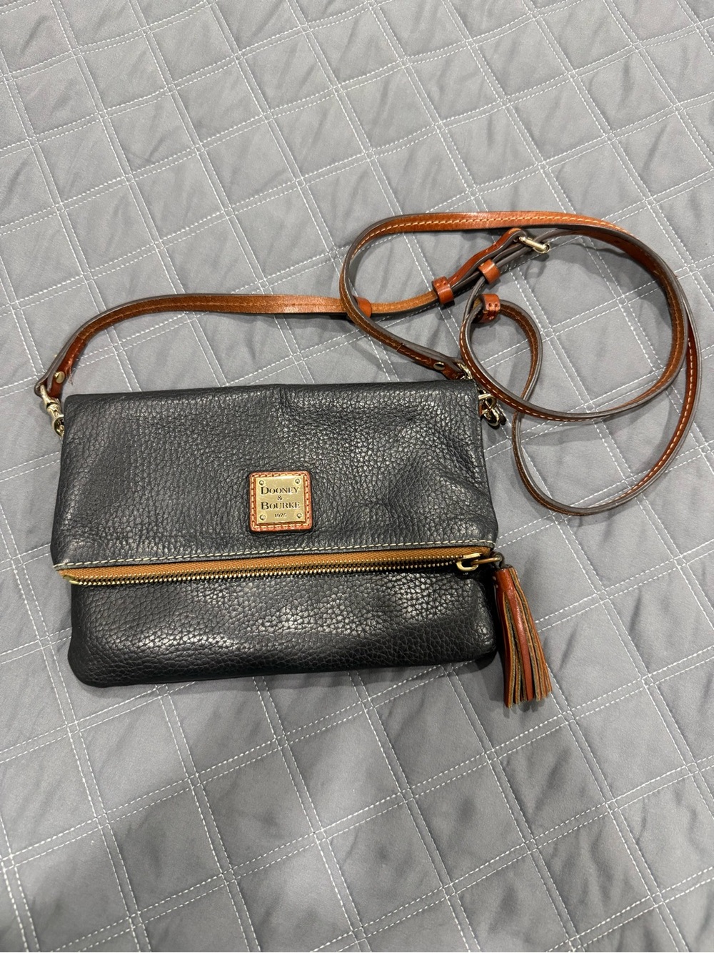 Dooney & Bourke Black Leather Crossbody with Brown Strap and Tassel